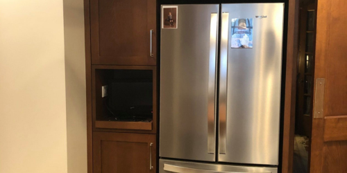 Modern kitchen area with new refrigerator and pantry by Fears Construction featuring B Design in Joliet, IL.