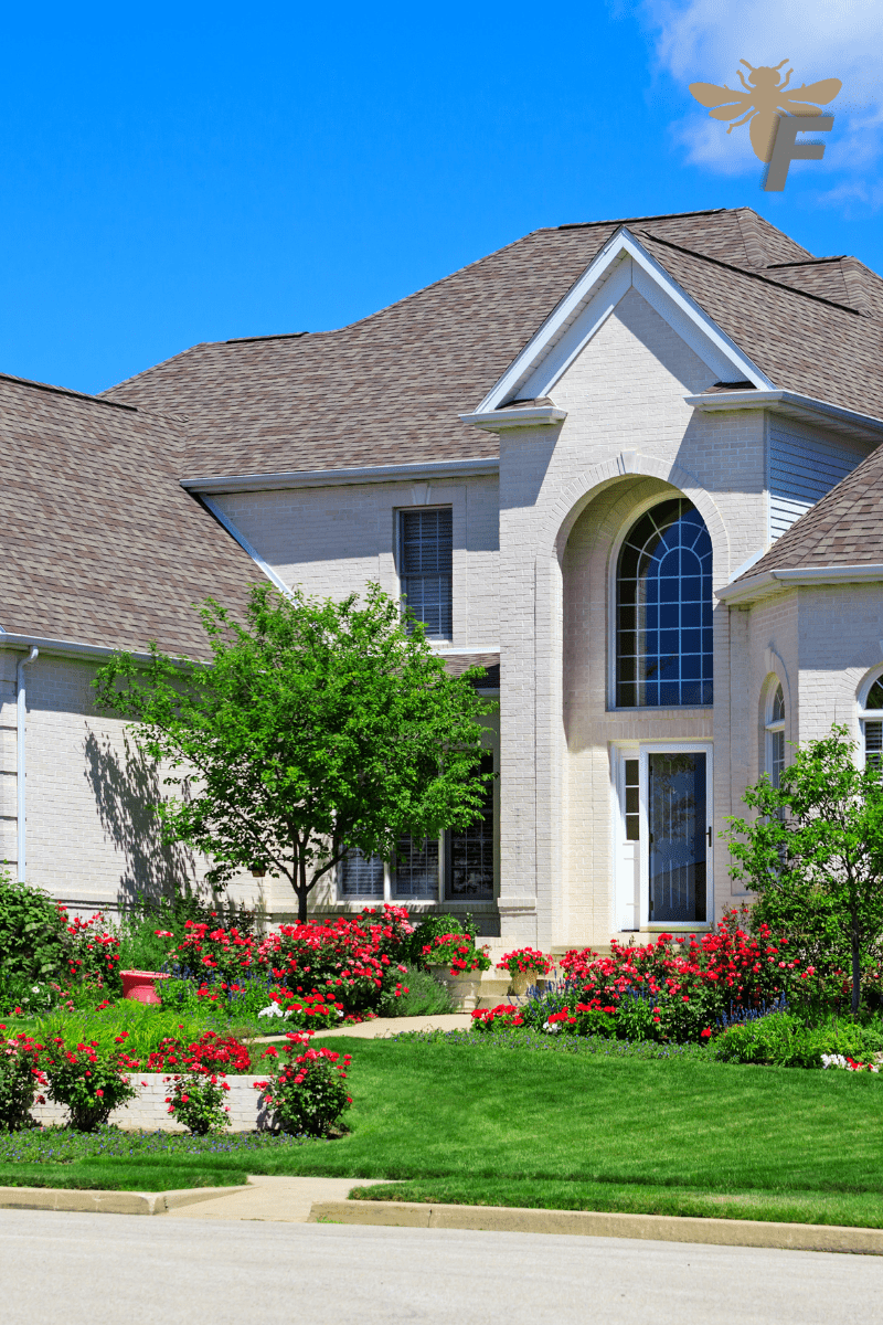 Modernized home in, featuring freshly painted beige brick exterior.