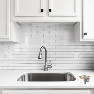 Classic white subway tiles create a clean, timeless look in a modern kitchen.