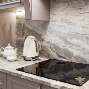 Marble natural stone tiles add luxury and sophistication to a modern kitchen backsplash.